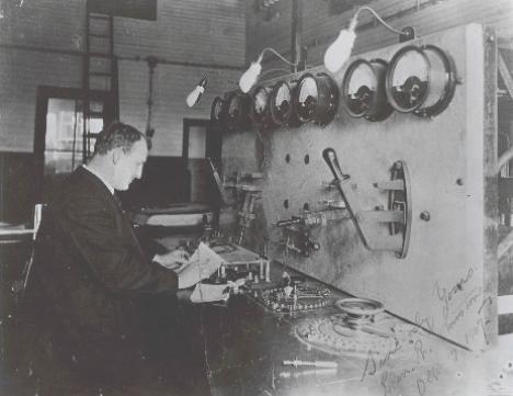 L. R. Johnstone transmitting messages in Morse Code to Clifden, Ireland, on the official opening day of the transatlantic service, 17 Oct 1907